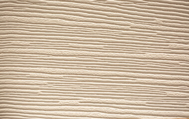 Brown background from decorative plaster with abstract spots. Unusual beige wall texture with beautiful patterns, creative surface background. Front covering for facing of buildings.