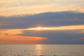 Fototapeta premium Picturesque view of sunset with beautiful clouds over sea
