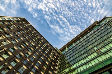 Low angle shot of modern buildings © Jo2agarpao/Wirestock Creators