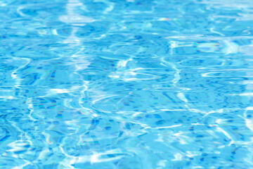Fototapeta na wymiar Rippled water in swimming pool as background