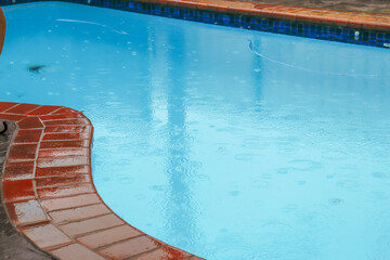 backyard swimming pool in the rain