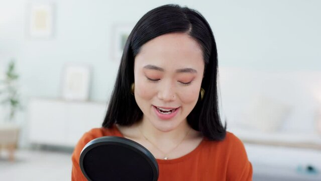 Podcast, microphone and woman live streaming on a social network talking or speaking on viral or trending news. Girl, Seoul and creative Asian girl influencer content marketing for online audience