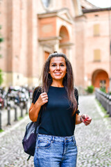  Beautiful smiling  tourist Woman on the street in  Bologna . Concept of Italian gastronomy and...