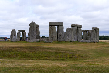 Fototapeta na wymiar Famous UNESCO World Heritage Site Stonehenge on Salisbury Plain in Wiltshire on a cloudy summer day. Photo taken August 2nd, 2022, Stonehenge, England.