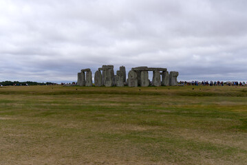 Famous UNESCO World Heritage Site Stonehenge on Salisbury Plain in Wiltshire on a cloudy summer day. Photo taken August 2nd, 2022, Stonehenge, England.