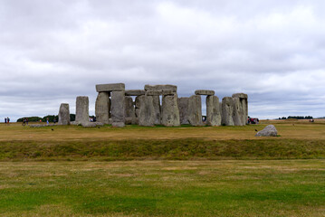 Famous UNESCO World Heritage Site Stonehenge on Salisbury Plain in Wiltshire on a cloudy summer day. Photo taken August 2nd, 2022, Stonehenge, England.