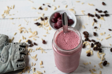 Whey protein shake with sour cherries, almonds and raisins for muscle building workout with fast...