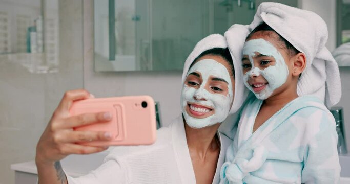 Beauty, skincare and facial with mother and girl and selfie in bathroom for health, spa and wellness. Luxury, product and mask on face with mom and child in family home for happy, peace and relax