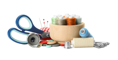 Spools of threads and sewing tools on white background