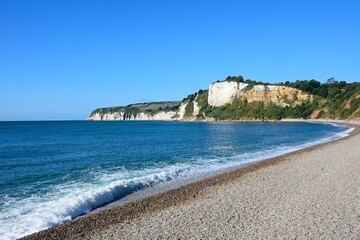 View along the pebble beach towards Beer Head, Seaton, Devon, UK, Europe.