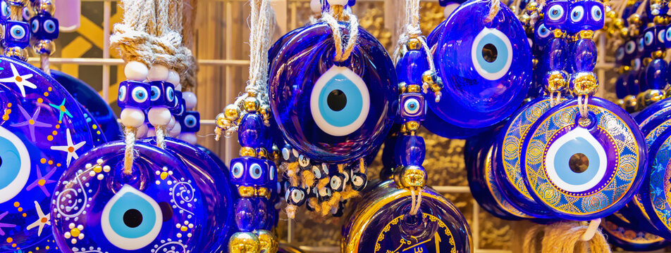 Traditional Turkish amulet Evil Eye or blue eye (Nazar boncugu). Souvenir of Turkey and traditional turkish amulet. Banner. Travel souvenir or gift concept