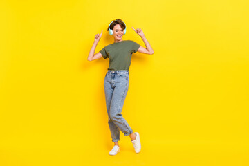 Fototapeta na wymiar Full length photo of positive lady arm direct empty space eyes closed sound song cool quality device isolated on yellow color background
