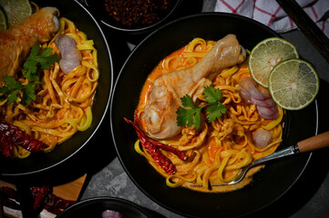Traditional northern Thai food, Khao Soi Kai, spicy creamy curry noodles with chicken
