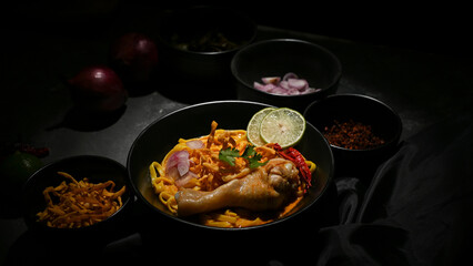 Chicken spicy curry with egg noodles and vegetables. Traditional Northern Thai food.