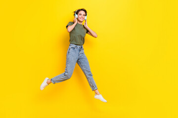 Fototapeta na wymiar Full length photo of funky overjoyed pretty lady dressed trendy outfit move step empty space good mood isolated on yellow color background