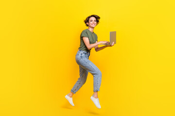 Full length photo of funny funky stylish lady use modern technology device gadget enjoy fast connection isolated on yellow color background