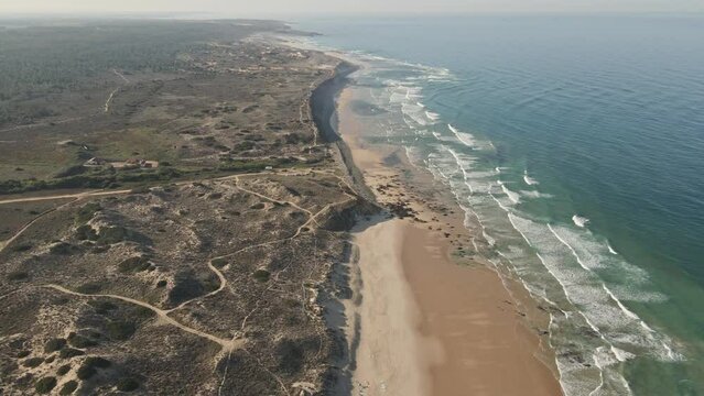 Aerial view of breathtaking beach in Alentejo, Portugal. Drone flying forwards over Aivados, Porto Covo.