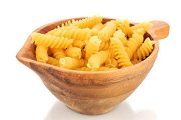 Durum wheat pasta in a wooden cup, macro, isolated on white background.