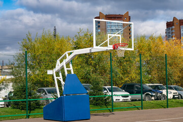 Fototapeta na wymiar Basketball backboard with a red basket for the ball.