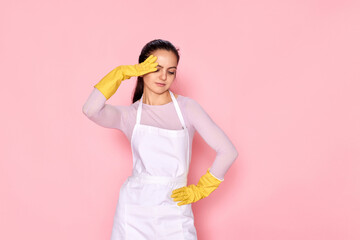 tired woman in gloves and cleaner apron