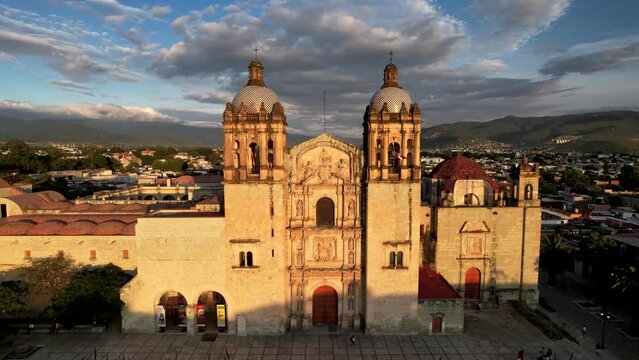 backwards drone shot of santo domingo temple in downtown oaxaca city in mexico