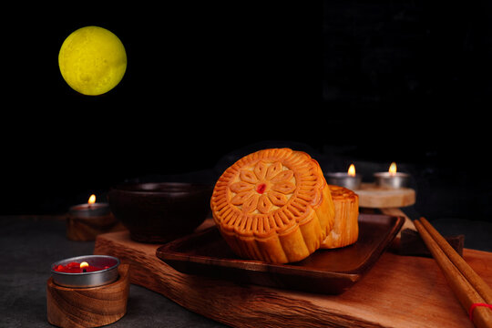 Mooncakes on a wooden tray or Mid-Autumn Festival for auspiciousness