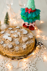 Christmas cake. Cake with Christmas decor. Honey cake. Homemade cakes. Christmas cookies and christmas tree.