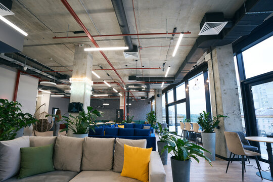 Modern comfortable zoning in coworking space, relaxation and communication area