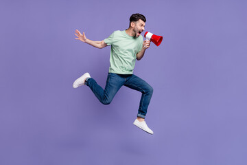 Full body photo of attractive young man jump hold loudspeaker angry boss yell dressed stylish gray...