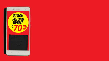 Word text black friday event up to 70% off written on yellow circle with black paper bag inside white smartphone isolated on red background. banner. copy space