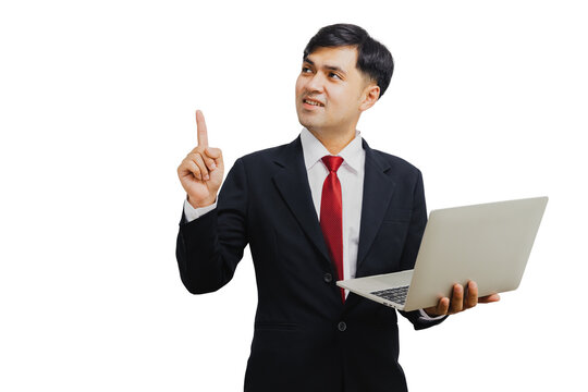 Asian Handsome Businessman In Suit Holding Laptop And Pointing To Present 