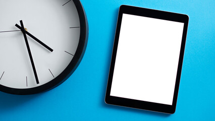 Overhead Flat Lay Business Shot Of Digital Tablet With Blank Screen And Clock