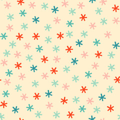 Cute snowflakes Christmas seamless pattern. Pastel blue, pink and red falling snow on cream background. Vintage winter holiday gift wrap.