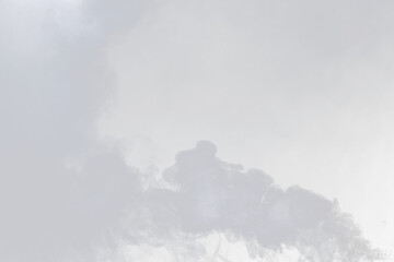 Dense Fluffy Puffs of White Smoke and Fog on black Background, Abstract Smoke Clouds, Movement...
