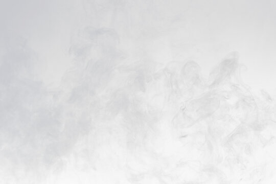 Dense Fluffy Puffs of White Smoke and Fog on black Background, Abstract Smoke Clouds, Movement Blurred out of focus. Smoking blows from machine dry ice fly fluttering in Air, effect texture, png
