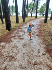 boy running through the forest