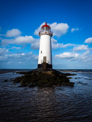Fototapeta na wymiar Low angle photograph of The Point of Ayr Lighthouse 