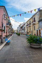 The beautiful main street of San VIto Chietino with colored flowers and facades