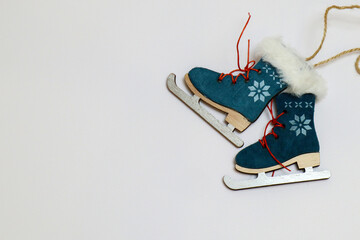 the background is New Year and Christmas. Christmas tree toy skates on a white background
