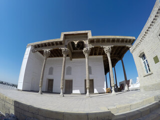 Building with bright columns and painted ceilings in Memorial complex of Naqshbandi: Pilgrimage site near Bukhara, Uzbekistan