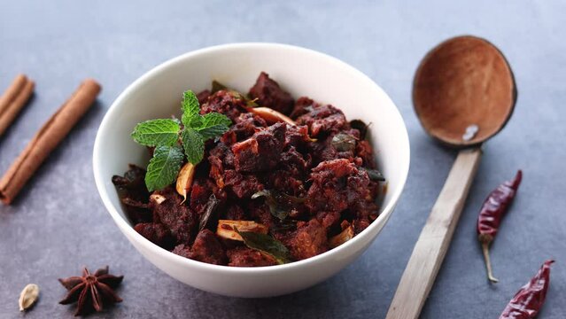 Beef fry curry roast mutton curry meat dish Kerala, India. Hot and spicy homemade side dish of Kappa biryani , Appam, Parotta, Puttu. South Indian non veg food