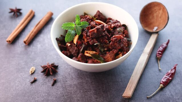 Beef fry curry roast mutton curry meat dish Kerala, India. Hot and spicy homemade side dish of Kappa biryani , Appam, Parotta, Puttu. South Indian non veg food