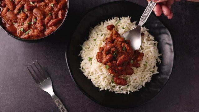 Kidney bean curry or rajma or rajmah chawal and rice roti, typical north Indian food main course. Basmati rice with dal curry.  4k video footage