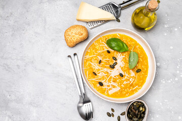 Pumpkin soup or pumpkin risotto with pumpkin seeds, with basil and olive oil. seasonal fall menu