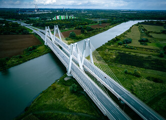 Modern Cardinal Macharski bridge over the Vistula River, Kraków, Poland, Europe by drone 