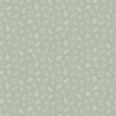 Seamless pattern of small scattered cream leaves on a green background
