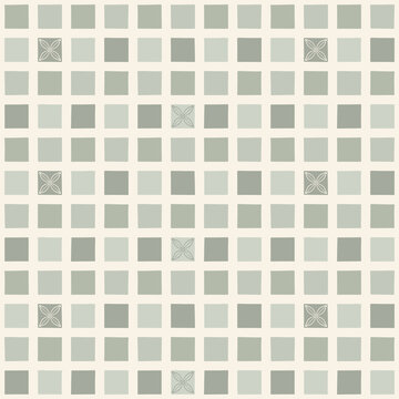 Seamless pattern of small squares with a scattered motif design in shades of green.
