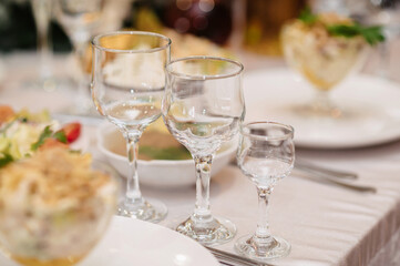 festive table with glasses and food on the table in the restaurant