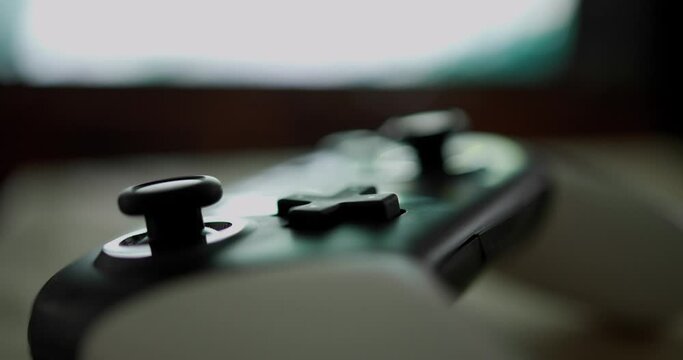 Video game joystick over the television at home