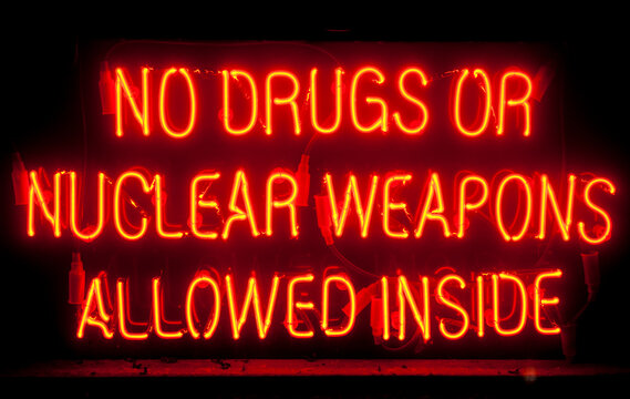 Orange Neon Sign With Words, No Drugs Or Nuclear Weapon Allowed Inside